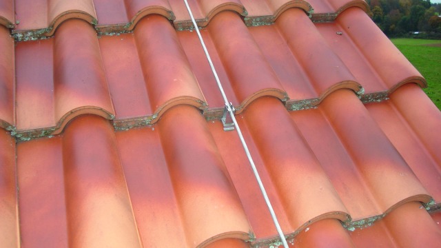 Roof Conductor Holders with Angled Flexible Base Brace for Roof Surfaces