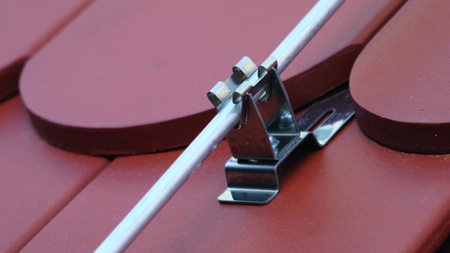 Roof Conductor Holders with Embossed Brace for Roof Surfaces